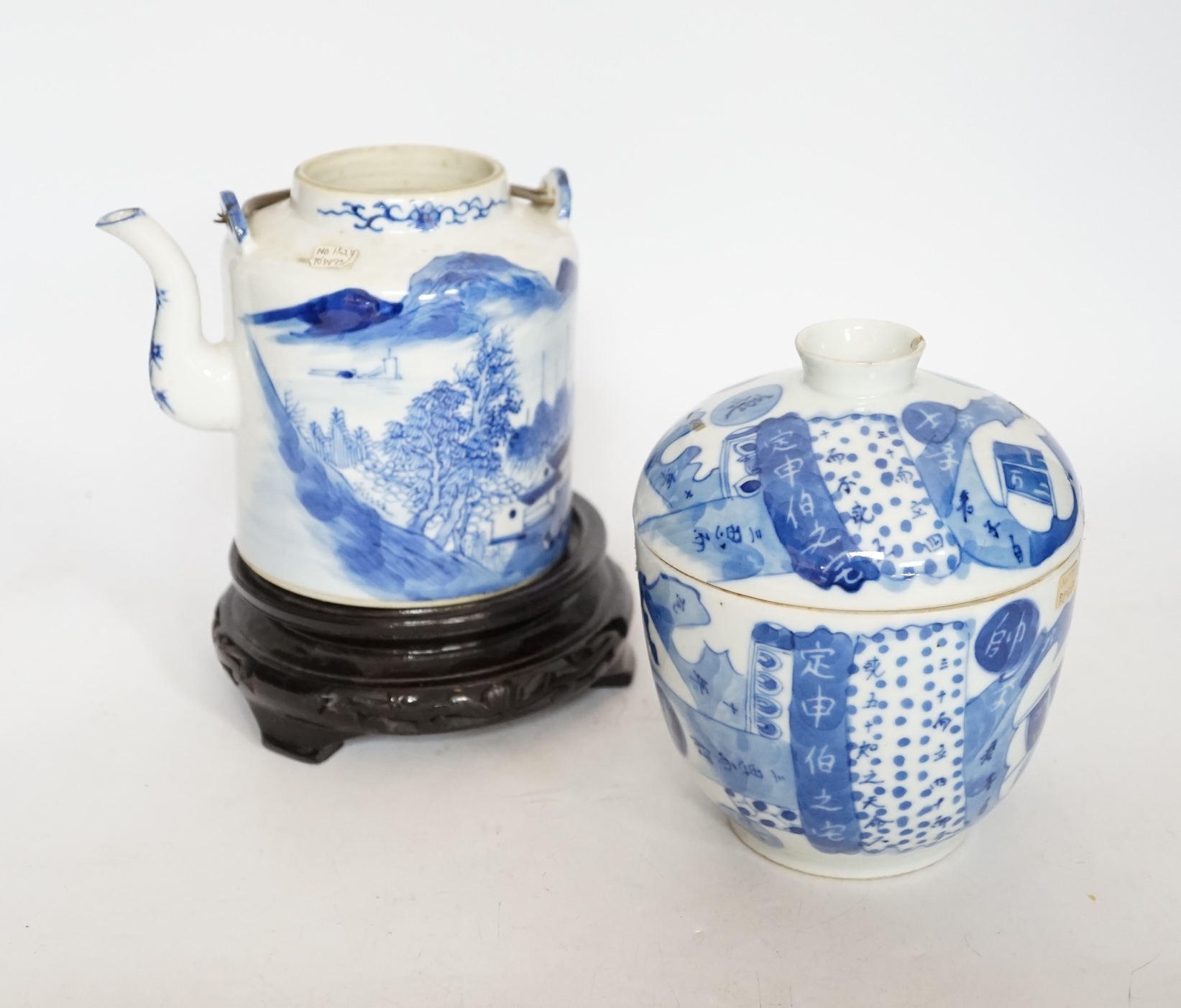 A Chinese Straits blue and white jar and cover, 19th century, a cylindrical teapot and an associated hardwood stand, largest 15cm high